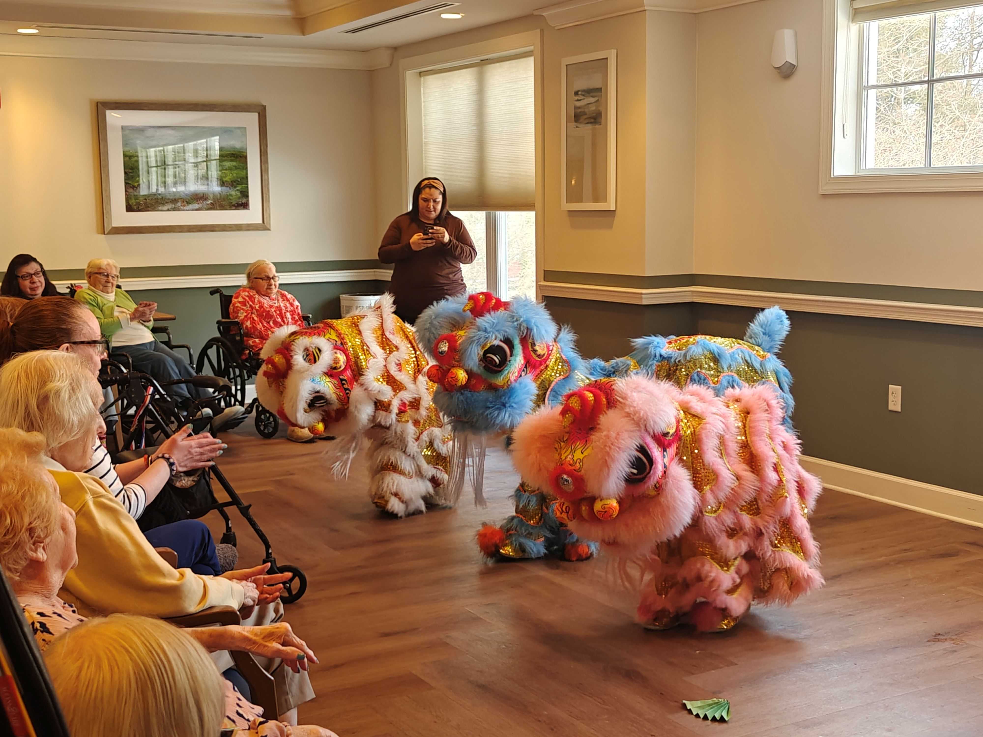 Young lion dancers performing for an audience